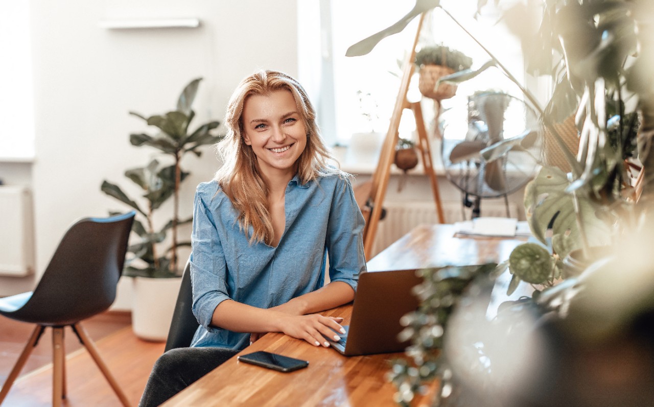 Positive business woman and her occupation in cosy office in daytime