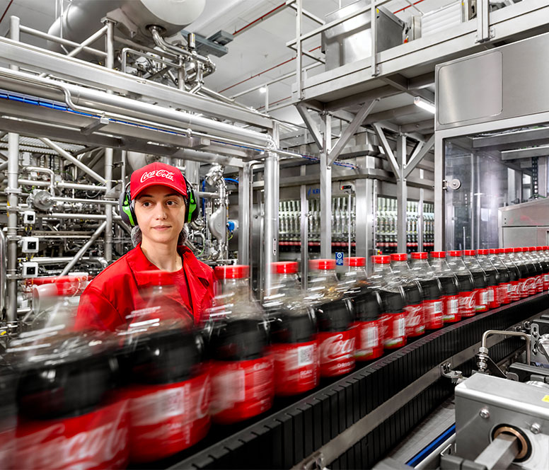 girl-into-CocaCola-production-776x664